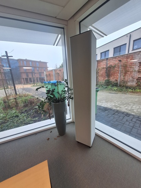 COUSTbase grey, at a window